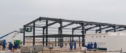 Crew working on an erected steel frame