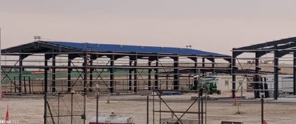 Long steel shelter framework with roof sheeting started