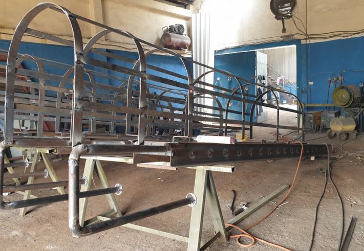 Curved steel frames being fabricated in the workshop