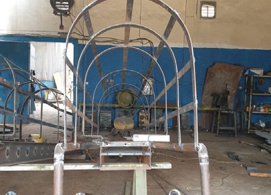 Arched steel frames set up in the workshop